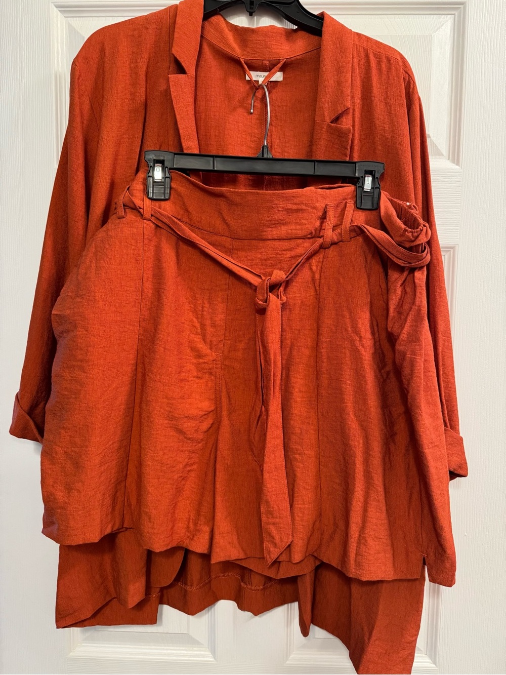 Maurices Asymmetrical Rust Tie-Waist Shorts with matching jacket.
